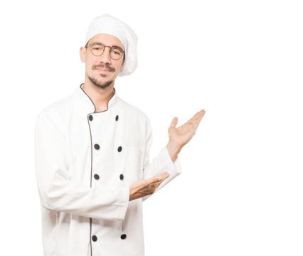 Friendly young chef making a gesture of welcome
