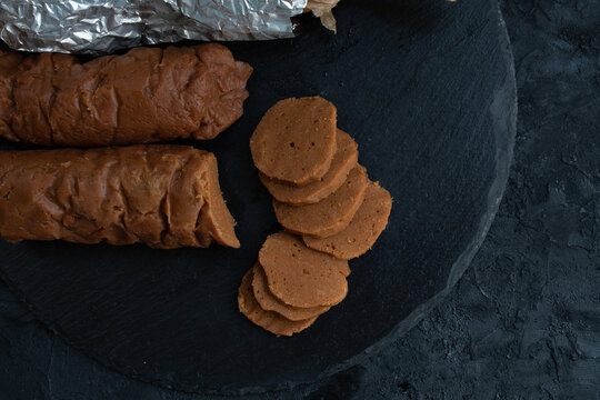 Cooked Seitan Sausages On Slate Board