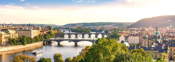 Light Sunset Panorama of Prague in Warm Colors, European City River with Bridges Connecting Old and New Town