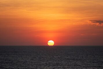 Beautiful, golden sunset over the calm ocean.