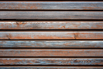 long, smooth wooden slats with worn paint, selective focus