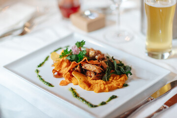 Delicious dinner beautifully arranged on a dinner plate.