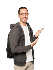 Friendly student making a gesture of welcome