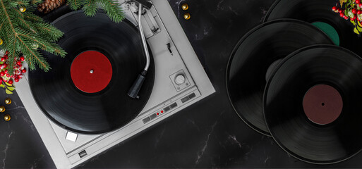 Turntable Vinyl records, Christmas party music, New Year events, fir branches, top view. Empty copy...