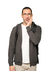 Concerned student with a toothache gesture