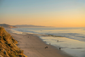 Panoramic beach view at Del Mar Southern California with people enjoying the sunset