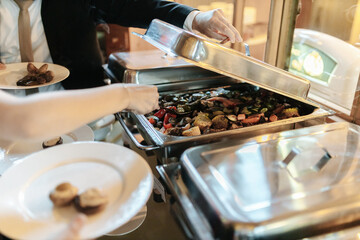 Delicious food in a silver tray at a buffet