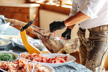 Iberian ham. Meat of a pig's leg. Spanish ham at a buffet