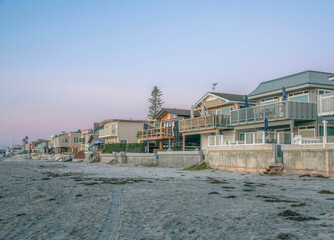 Fototapeta na wymiar Houses with beach and seashore views at Del Mar Southern California at sunset.