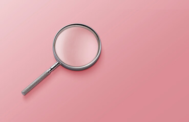 magnifying glass on pink background top view lying flat copy space concept