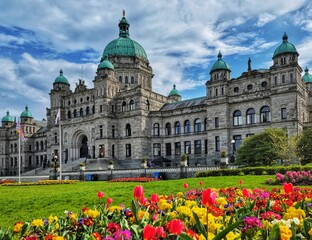 Legislative Assembly of British Columbia and beautiful colorful flowers in a garden