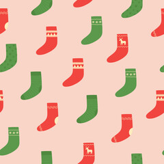 Seamless pattern of colorful Christmas socks on pink background. Doodle style. Christmas winter background. 