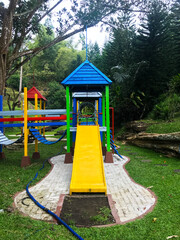 Modern Playground Equipment. Modern Colorful kids playground on yard in the park. image for background of playground, activities at public park.