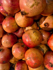 Background of juicy and ripe pomegranates. Ruby natural pomegranate fruit.