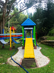 Modern Playground Equipment. Modern Colorful kids playground on yard in the park. image for background of playground, activities at public park.