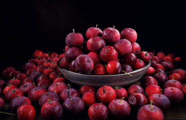 Fototapeta na wymiar Full plate of fresh red apples. Lots of ripe apples.