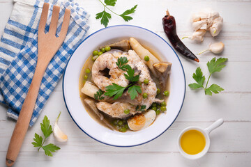 Conger eel with white asparagus and egg. Traditional Spanish tapas from a fishing village.