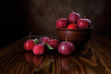 Clay plate with red apples. Red ripe apples.