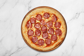 Pepperoni pizza on wooden board on gray background