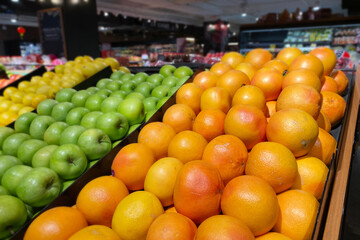 Oranges display in supermarket. Produce market display