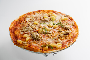 Hawaiian pizza isolated on white background. Pineapple, Chicken, Cheese and bolognese sauce topping