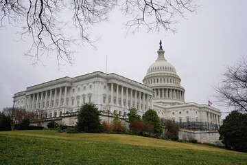 View of the senate capitol building in Washington DC during cloudy day in winter 2022. View from National mall 