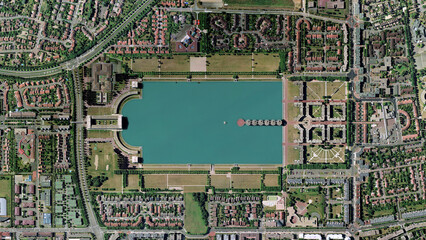 Lac de la sourderie buildings inside the giant pool looking down aerial view from above –...