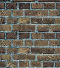 Fototapeta premium Faded old red brick wall, wide rough vintage texture. Dirty wall with grunge rectangular blocks, close-up, grungy texture