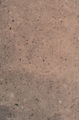 Old antique concrete pavement, yellowed grungy vintage background close up, grunge texture.