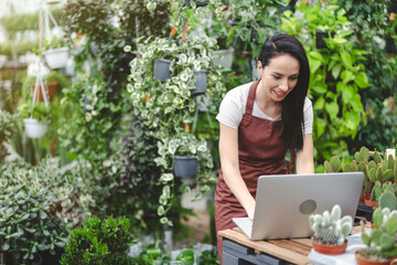 Garden center worker using laptop
