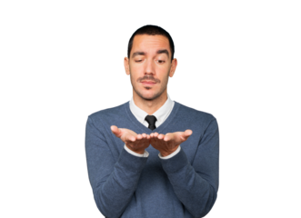 Doubtful young man holding something with his hand