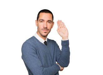 Concentrated young man making a gesture of trying to hear something