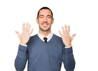 Young man making a number ten gesture