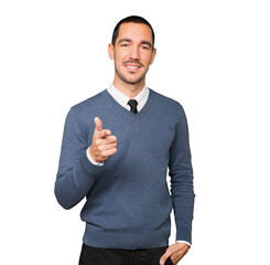 Happy young man pointing at you with his finger