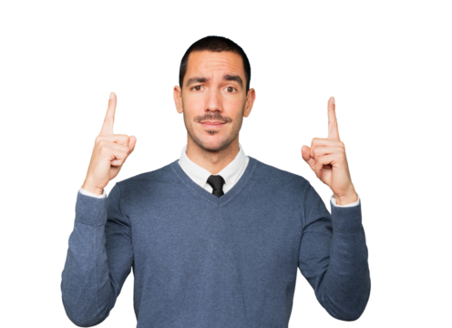 Hesitant young man pointing up with his finger