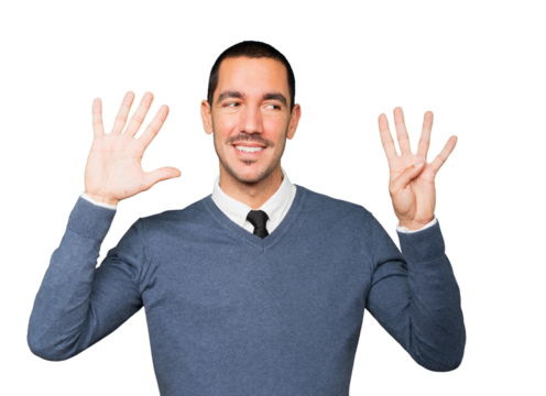 Happy young man doing a number nine gesture with his hands