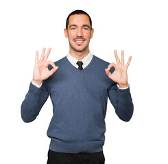 Fototapeta premium Happy young man doing an all right gesture