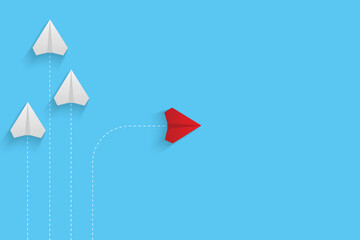 Creative paper planes on blue background. Think differently concept. Red airplane changing direction. New idea, change, trend, courage, creative solution, innovation and unique concept.