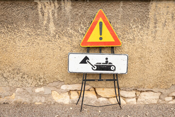 Work in action construction zone road signs in the village of Colognola ai Colli, Verona, Italy.