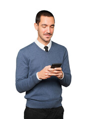 Happy young man using his mobile phone