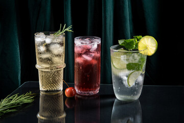 Three vibrant and sparkling alcoholic punch is perfect for Christmas party. Colorful cocktails in glasses.  Fresh holiday drinks.