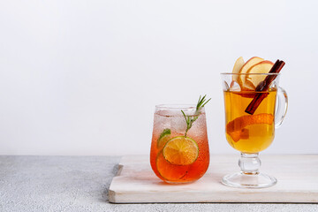 Two vibrant and sparkling non-alcoholic punch is perfect for summer gatherings . Colorful Christmas cocktails in glasses on white table.  Fresh holiday drinks.