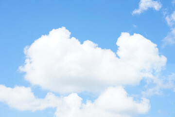Naklejka na ściany i meble beautiful puffy white clouds, background blue sky