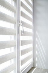 Window roller duo system day and night. Close up on roll curtains indoor.