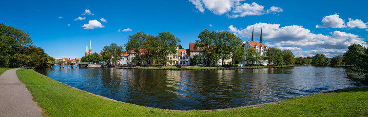 Fototapeta na wymiar Lübeck, Germany. View of the old town across the river Trave.