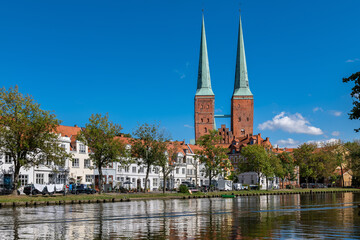 Naklejka premium Lübeck, Germany. View of the old town across the river Trave.