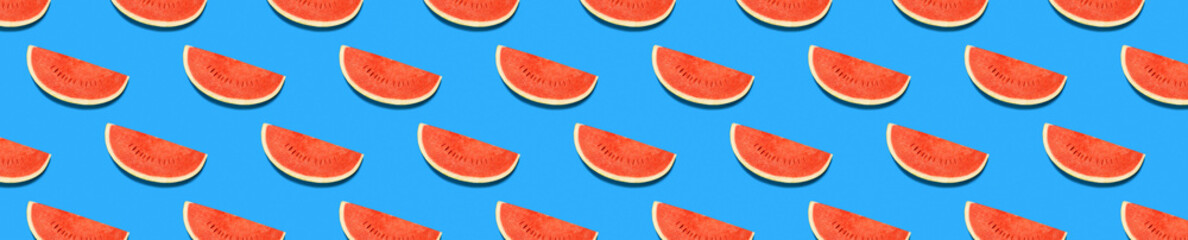 Red watermelon on a blue background. Watermelon pattern. Summer concert. Top view
