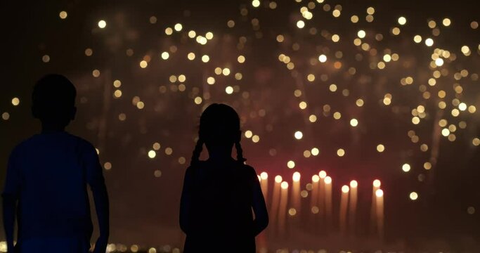 Boy and girl are watching fireworks