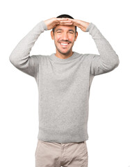 Astonished young man with a gesture of looking away