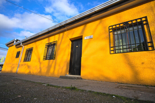 Facade of colorful adobe house in a village in south America, Talca, Chile © João Kermadec
